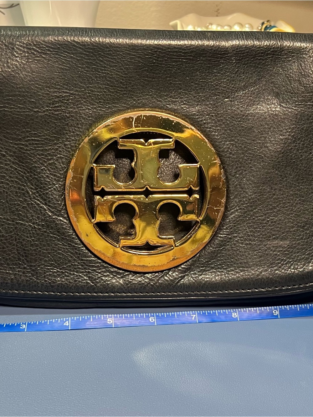 Pre-loved Tory Burch Black Leather clutch with Gold hardware